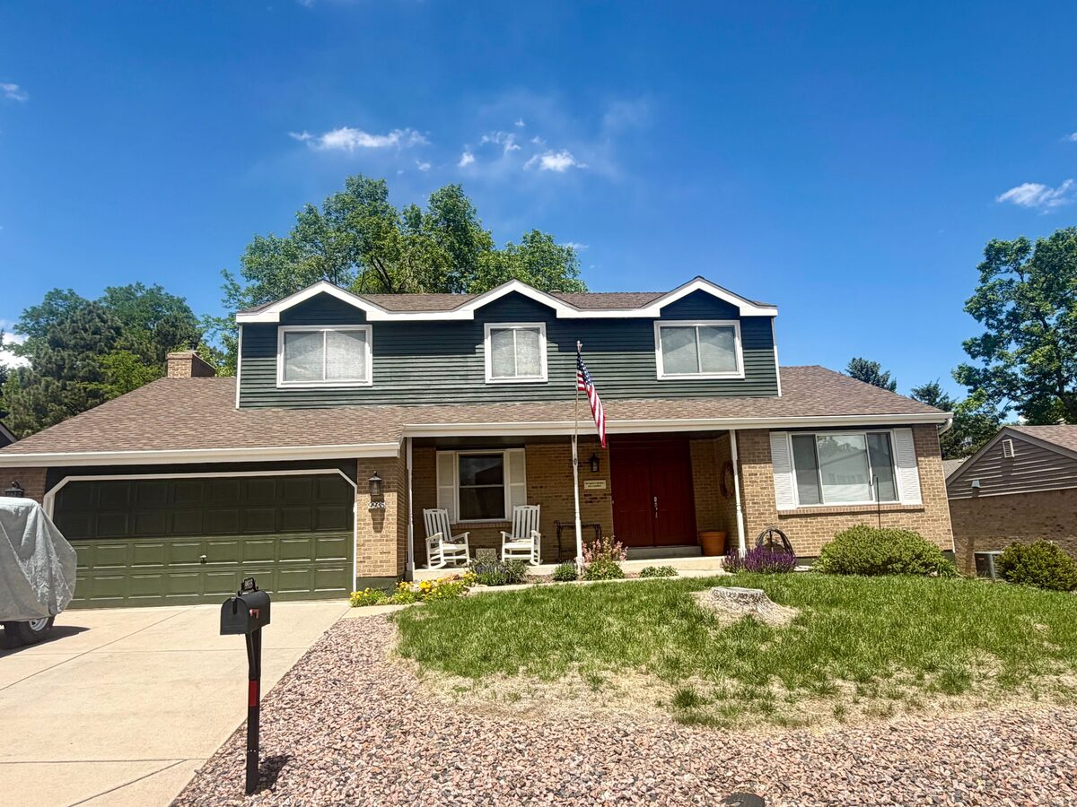 Repainted two-story suburban home exterior near Littleton